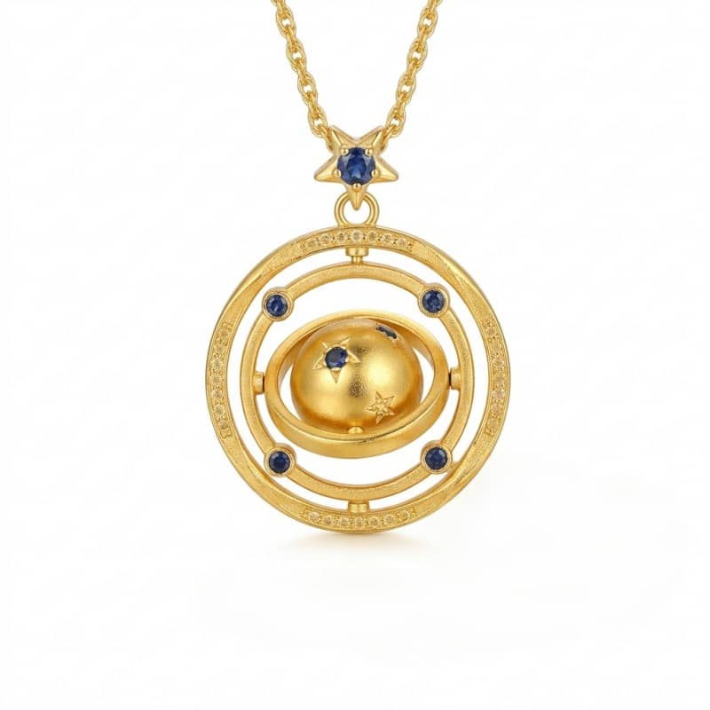 Mercury brand 24K gold plated necklace featuring a rotating 3D planet pendant with blue AAA zirconia stars and a celestial orbit ring.