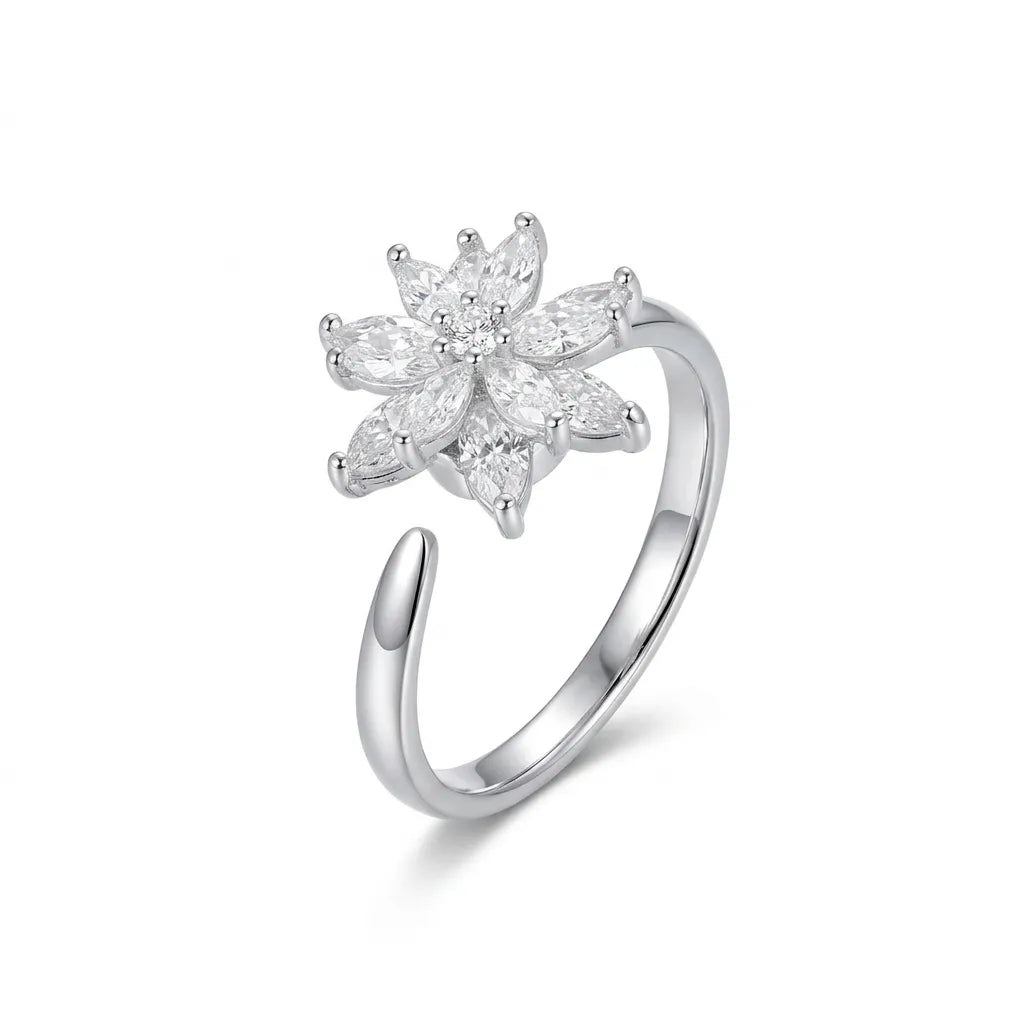 High-quality studio shot of a Mercury silver-tone adjustable open ring featuring a sparkling floral centerpiece made of marquise-cut AAA cubic zirconia, isolated on a pure white background.