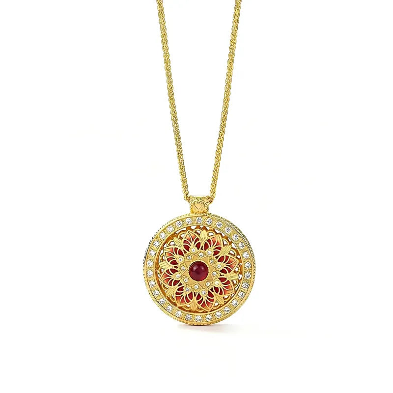 Lucky rotating lotus flower pendant with red gemstone and sparkling zirconia by Mercury jewelry.