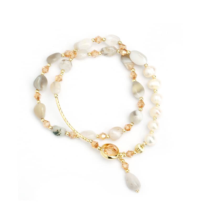 Mercury brand elastic stretch beaded bracelet featuring artificial pearls, grey stone beads, and a gold-plated stainless steel bar with a central zircon pendant on a white background.