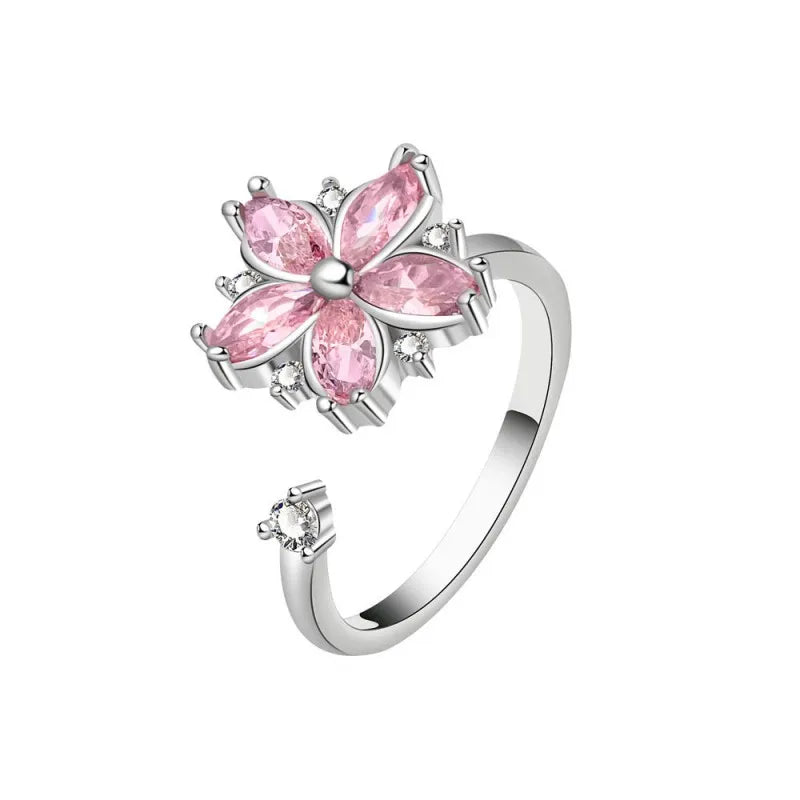 Sakura-inspired pink flower spinning ring with cherry blossom petals made of AAA cubic zirconia by Mercury Jewelry.