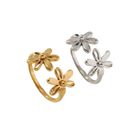 Mercury minimalist daisy ring in gold and silver finishes, adjustable open band with double flower motif on white background.