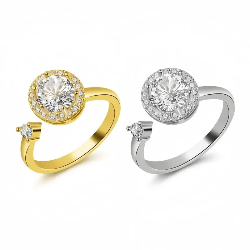 Mercury 24K gold and silver orbital spinning rings with AAA cubic zirconia halo, isolated on white.