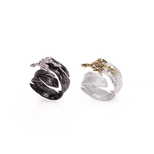 Mercury brand divine feather rings in mystical black and sacred silver finishes, featuring an intricate plume texture symbolizing spiritual power and celestial connection.