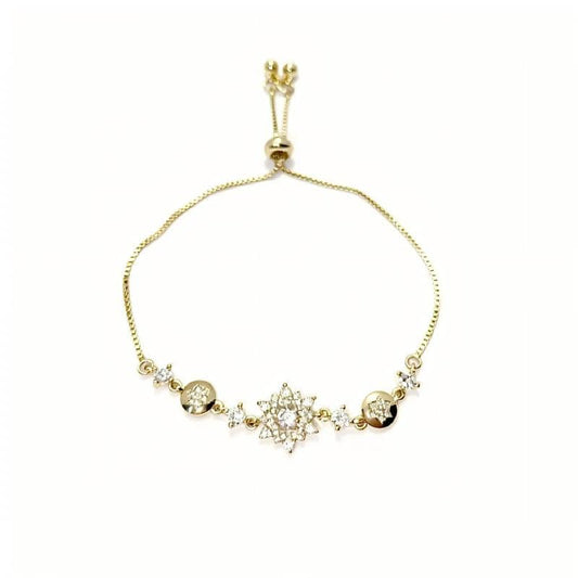 Mercury brand 36cm adjustable gold bolo bracelet with central cubic zirconia starburst motif, laid flat on white background.