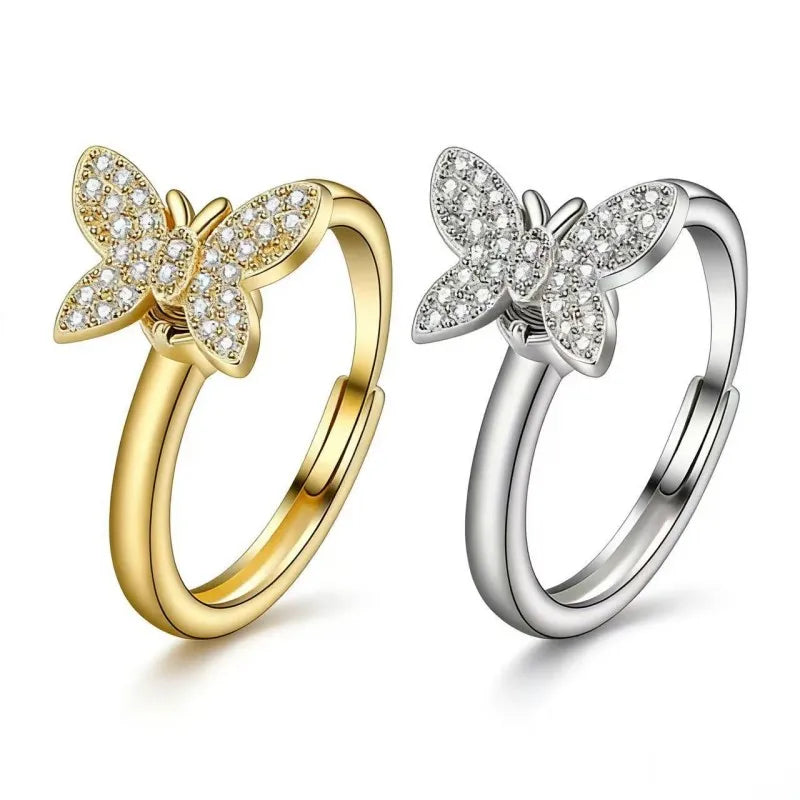 Minimalist spinning butterfly rings in 24k gold and silver plating featuring AAA cubic zirconia crystals for anxiety relief by Mercury Jewelry.