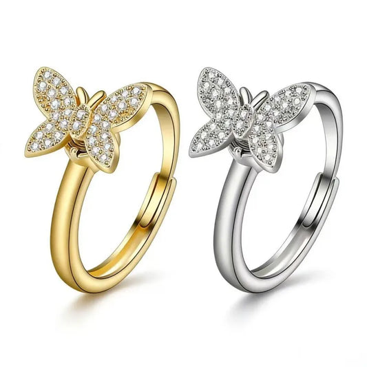 Minimalist spinning butterfly rings in 24k gold and silver plating featuring AAA cubic zirconia crystals for anxiety relief by Mercury Jewelry.