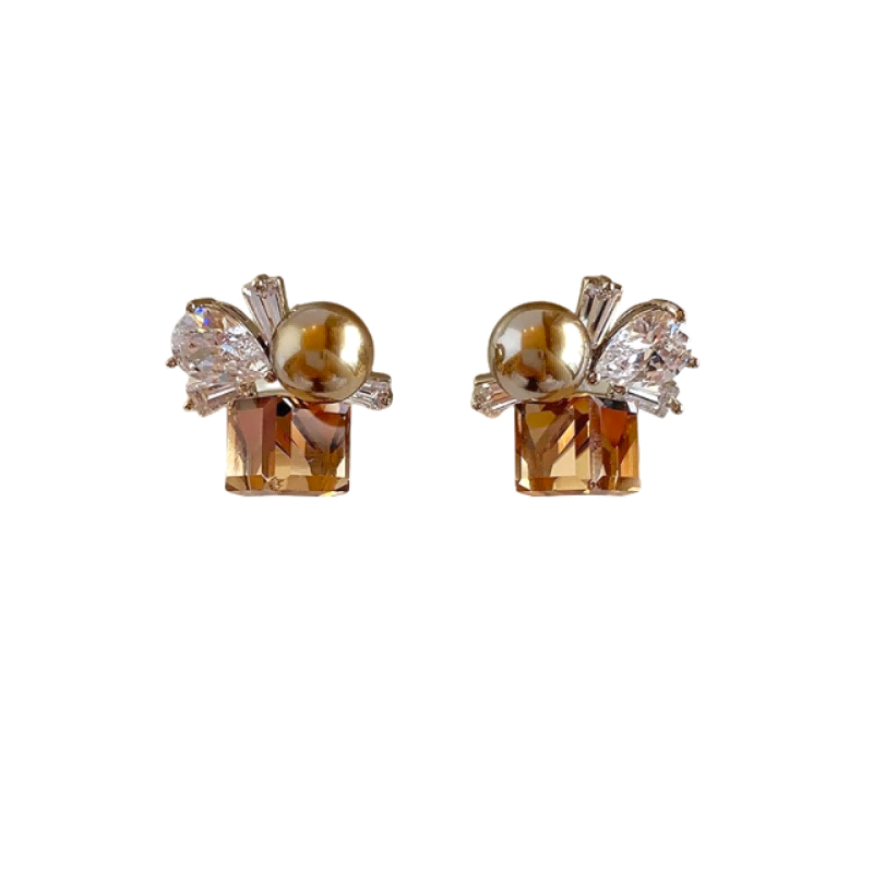 Mercury jewelry: Amber geometric gemstone earrings featuring a gold metallic bead and baguette-cut crystals, vintage-inspired design.